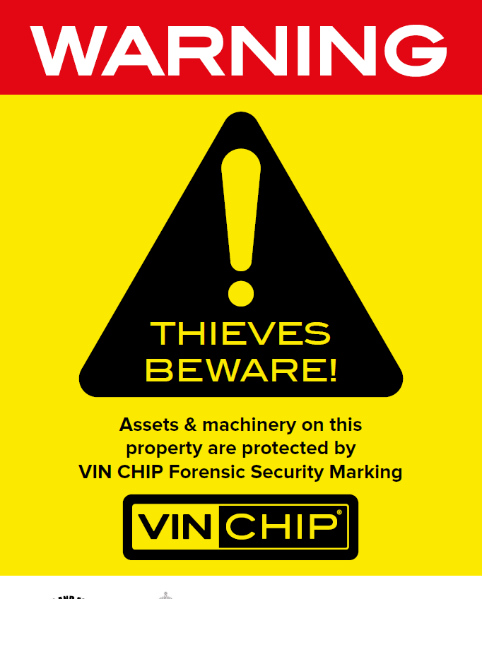 Bold VIN CHIP warning sign in red, black, and yellow, alerting thieves to security measures.