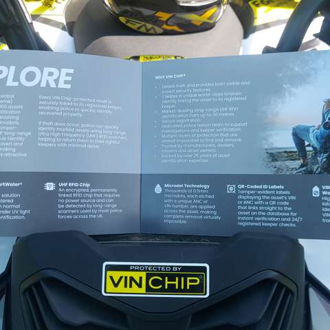 VIN Chip motorcycle security brochure displayed on a VIN Chip branded quad bike showcasing motorcycle theft prevention technology.