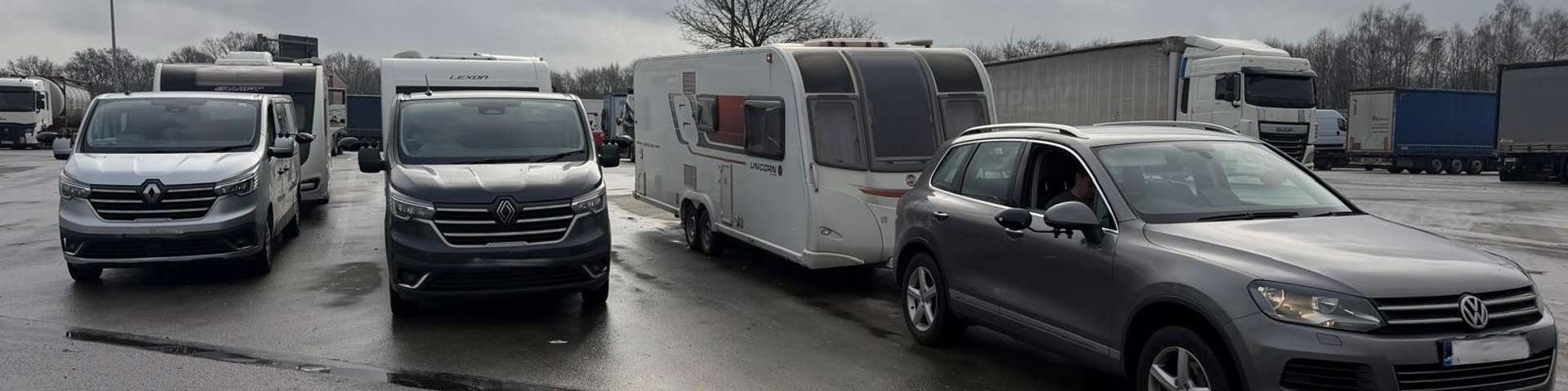 Three caravans being towed after being recovered from theft.