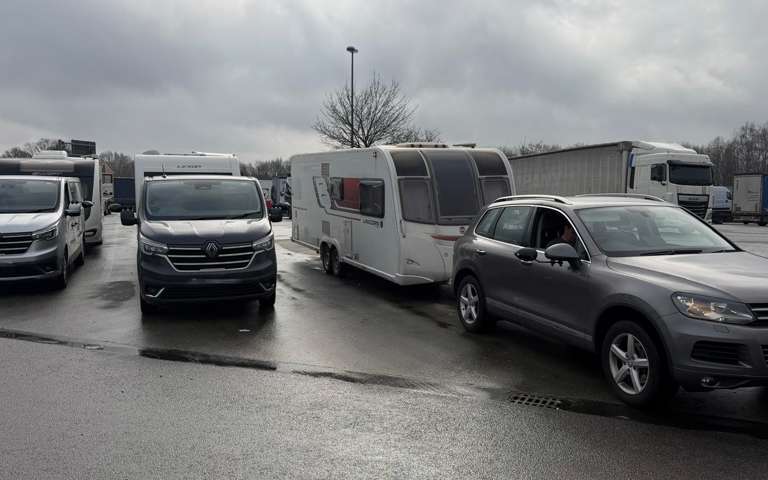 Three caravans being towed after being recovered from theft.